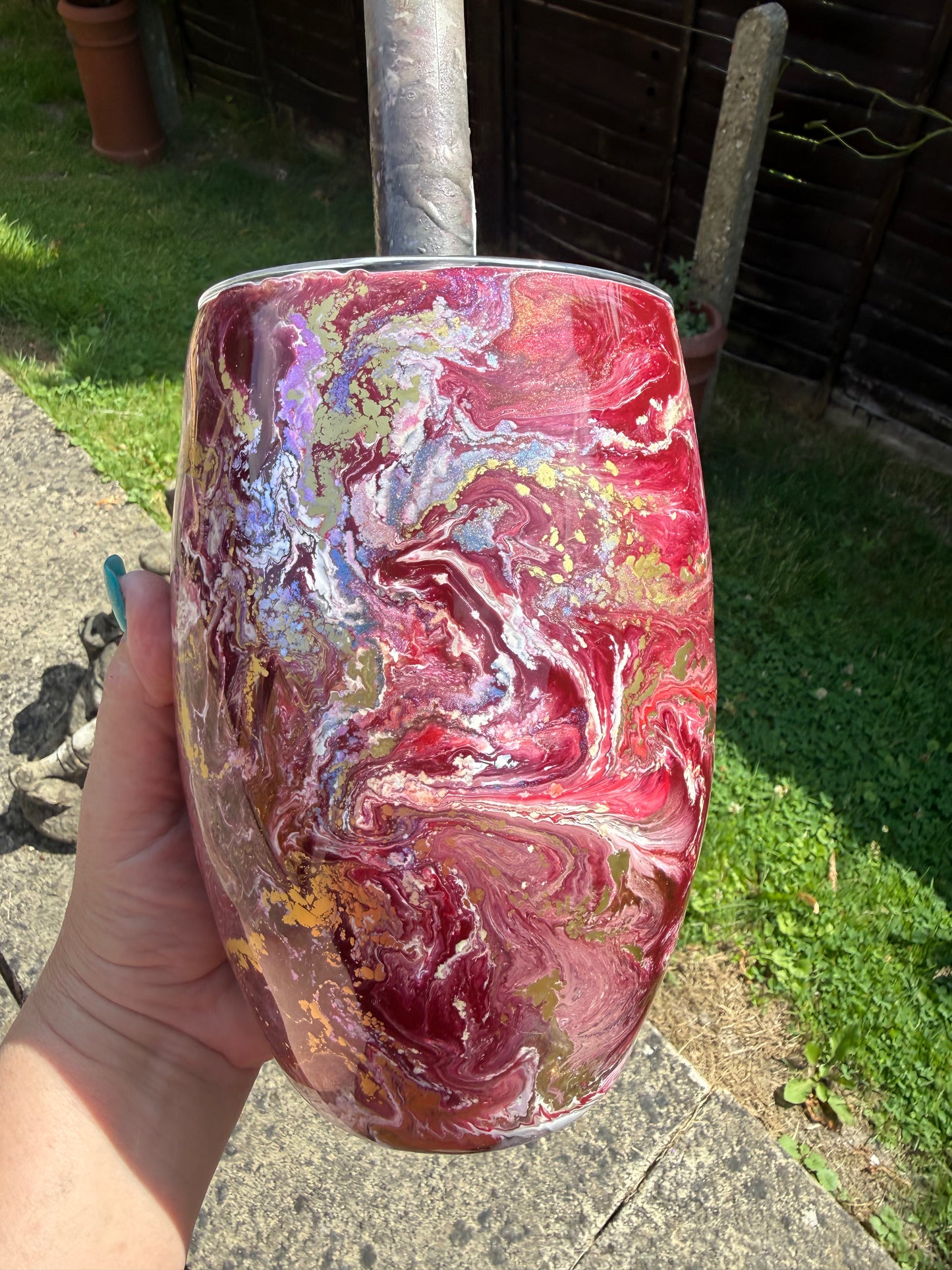Large rugby shaped vase . Flowers were added using AI .